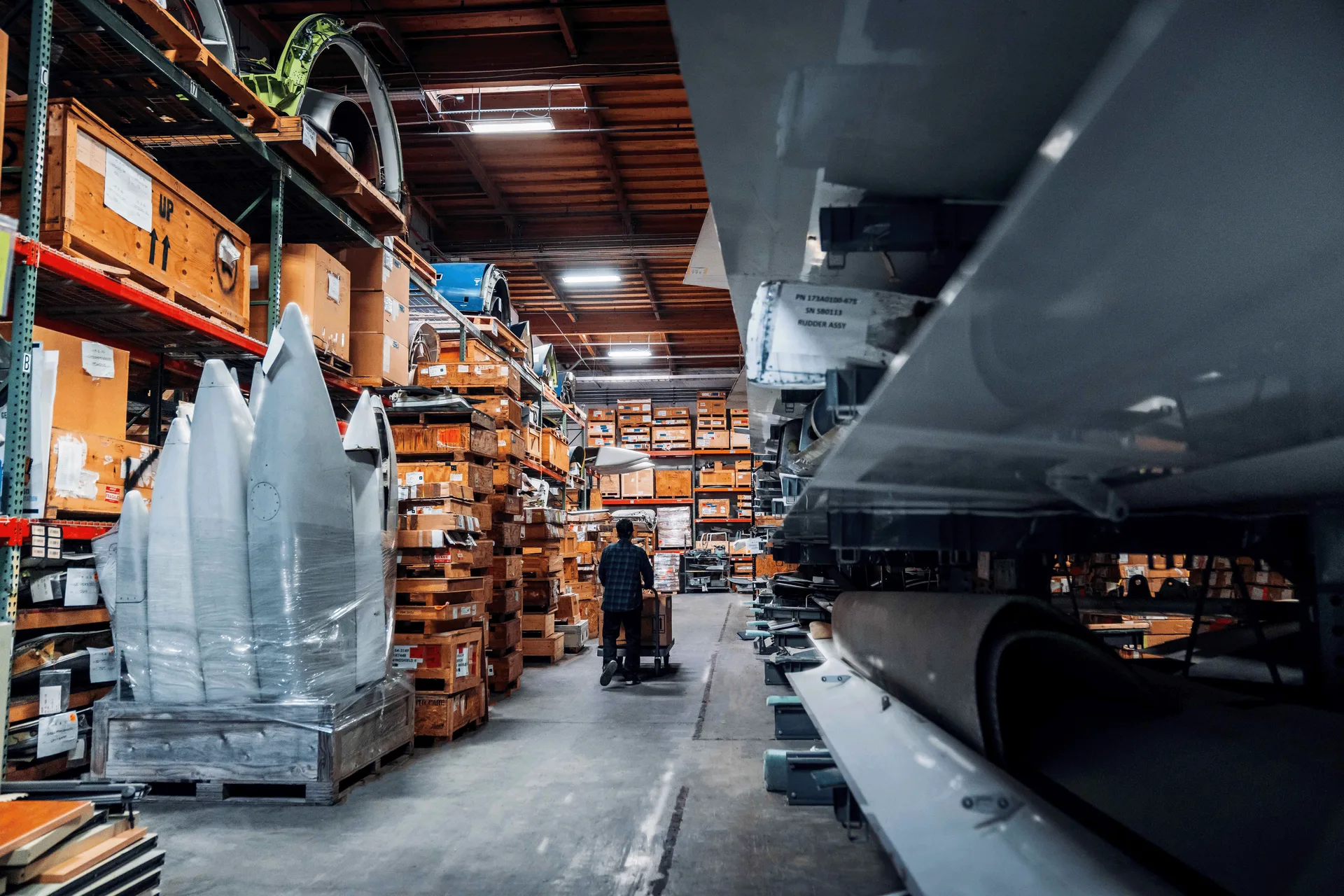 Aircraft components and shipping crates stored in the warehouse
